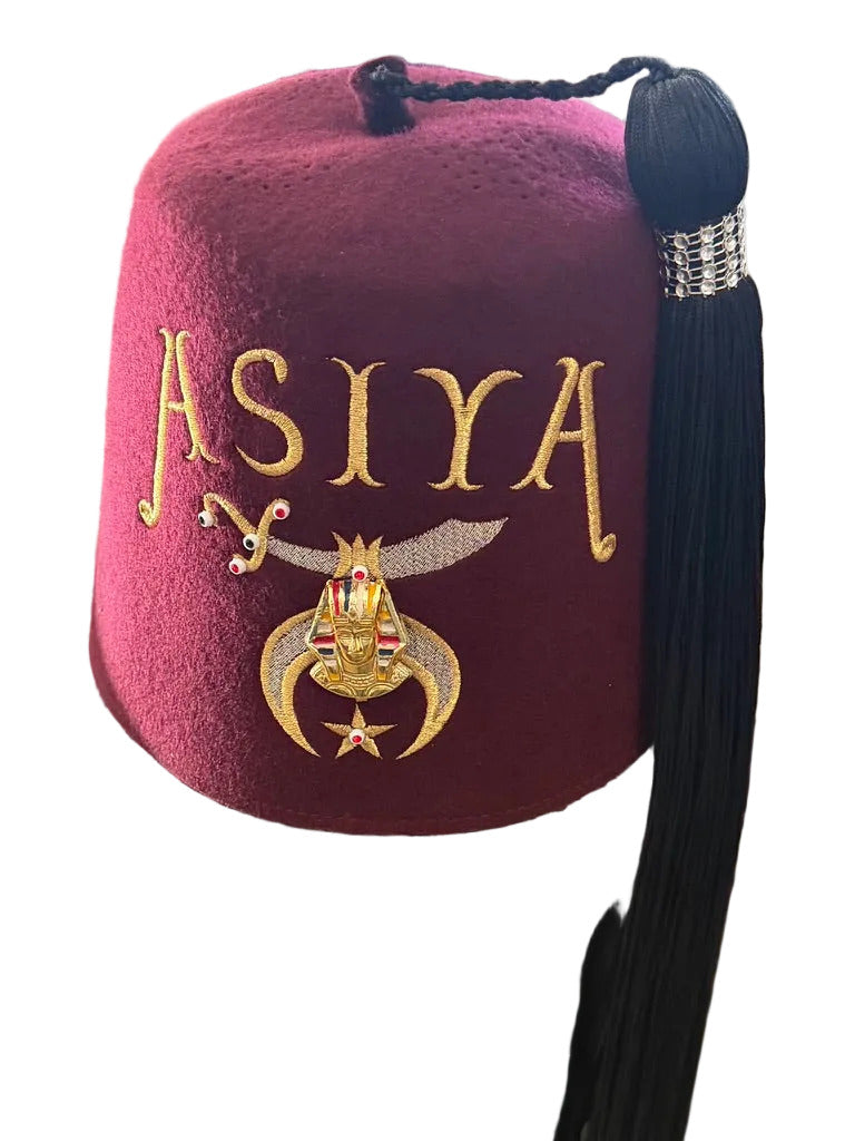 Burgundy Shriners fez with gold ASIYA lettering, emblem, and black tassel
