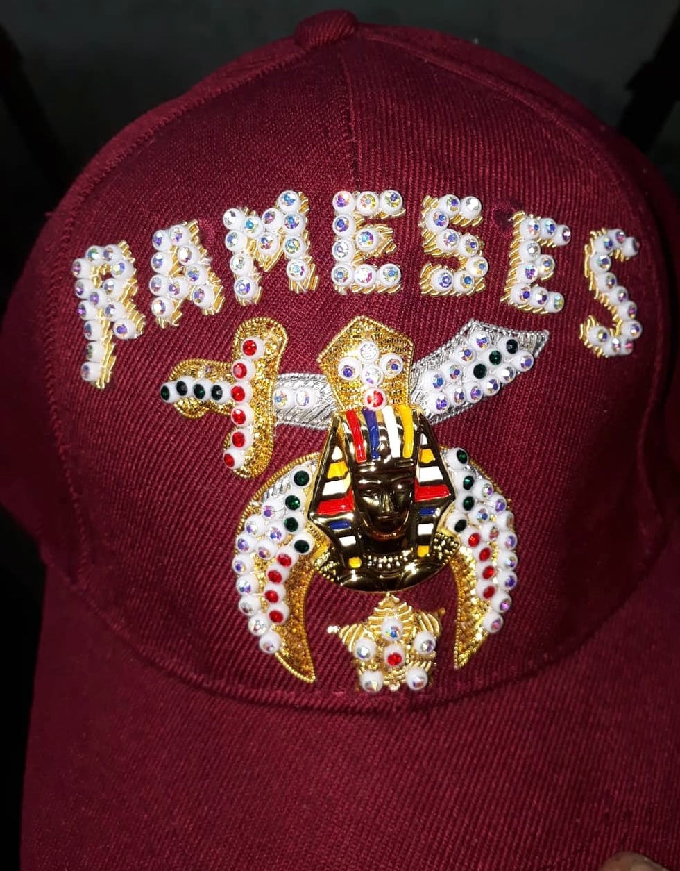 Burgundy jeweled Shriner cap with rhinestone temple lettering and Shrine emblem